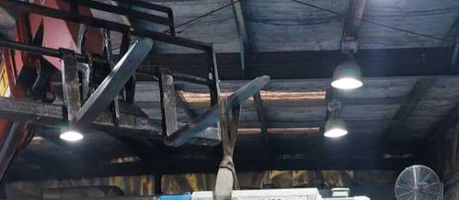 Overhead hoist and lighting inside the fabrication workshop